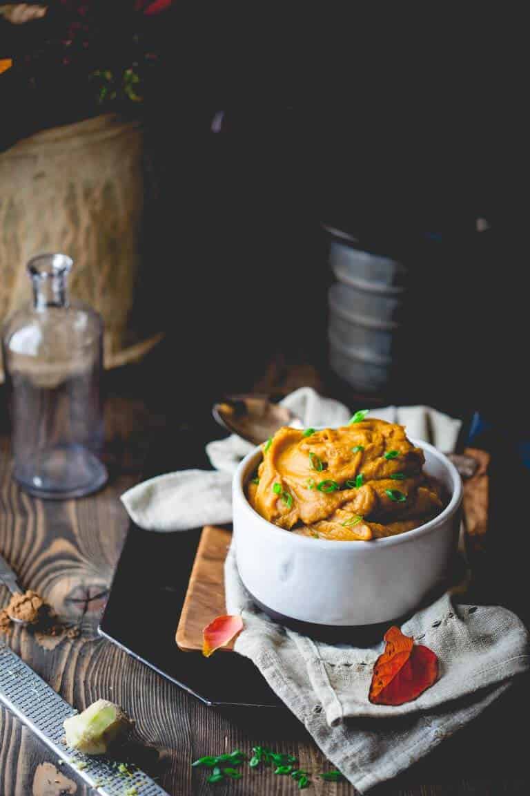 healthy mashed sweet potatoes in white bowl on plate