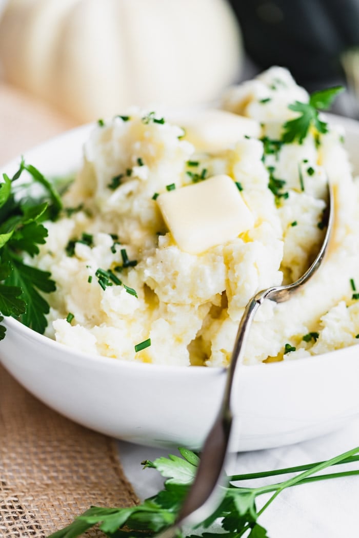side view close up of potatoes with butter on top