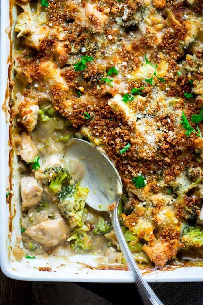 A close up look into a casserole of chicken divan with broccoli