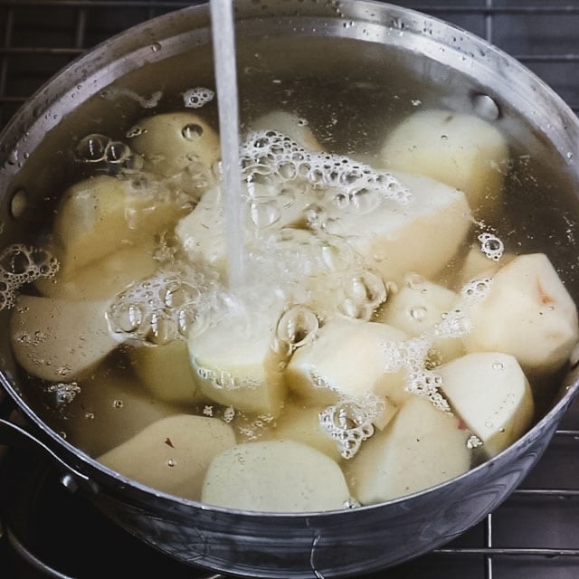 pour cold water over the potatoes