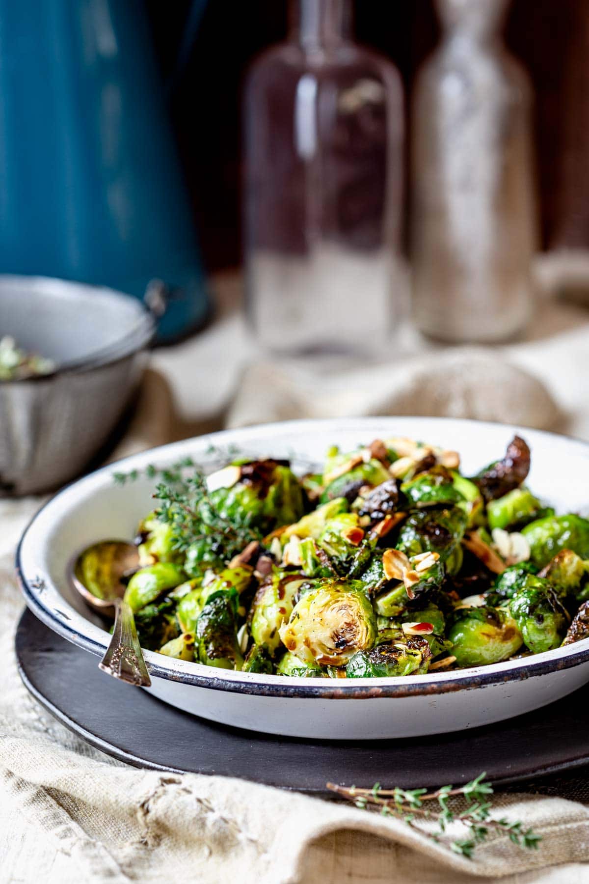 side view of a dish filled with roasted brussels sprouts