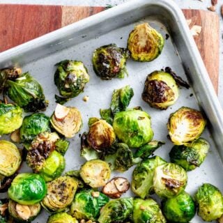 close-up of a sheet pan with roasted brussels sprouts on it