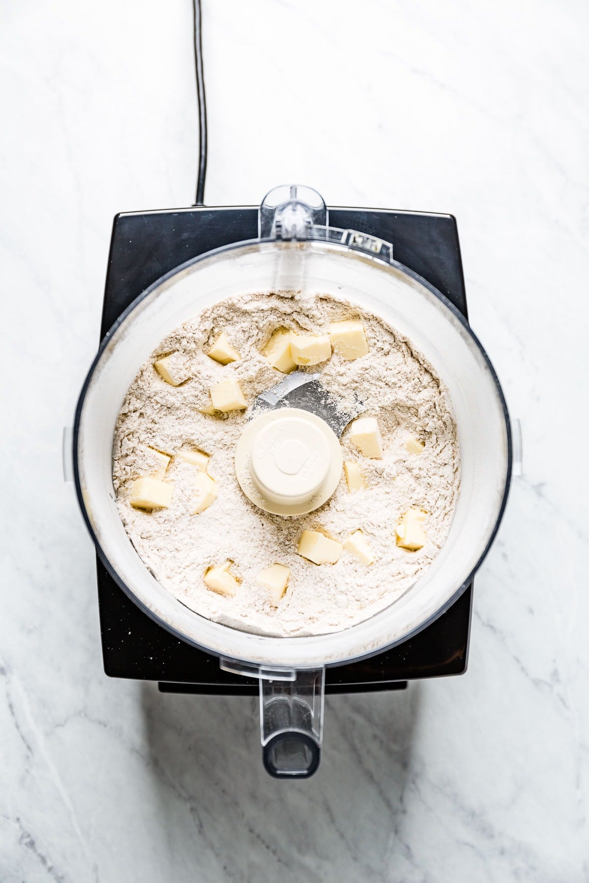 butter chunks in Flour in food processor