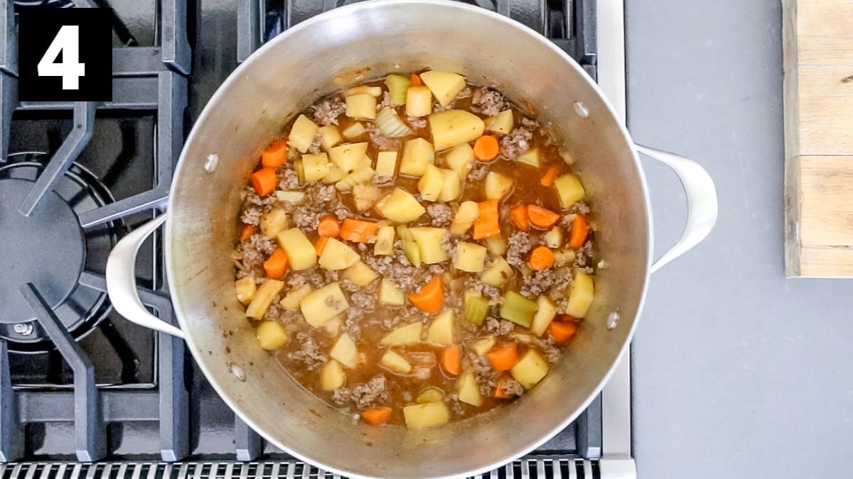 the stew after the ground beef is added back in and the veggies are tender