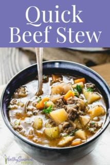 A bowl of beef stew on a table with a spoon in it and title text on top of the picture.