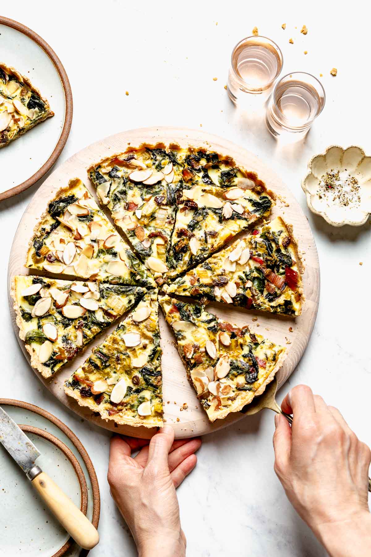 tart cut into wedges on a round board