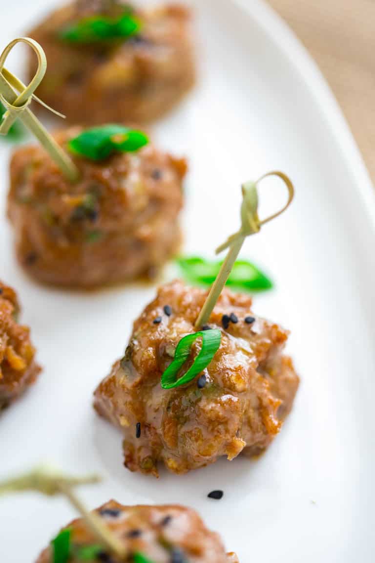 tamari turkey meatballs with maple tahini glaze on a plate