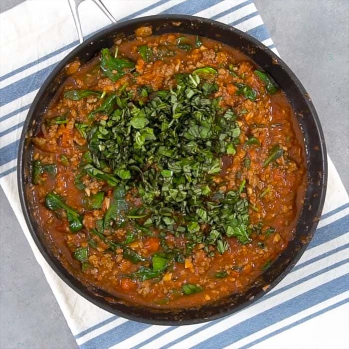 add tomatoes spinach and basil