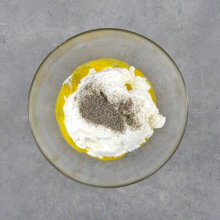 Stir ricotta with egg and pepper