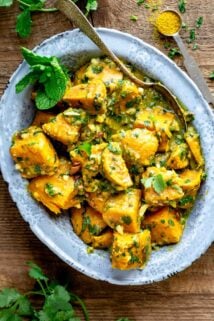 a metal dish with sweet potato curry