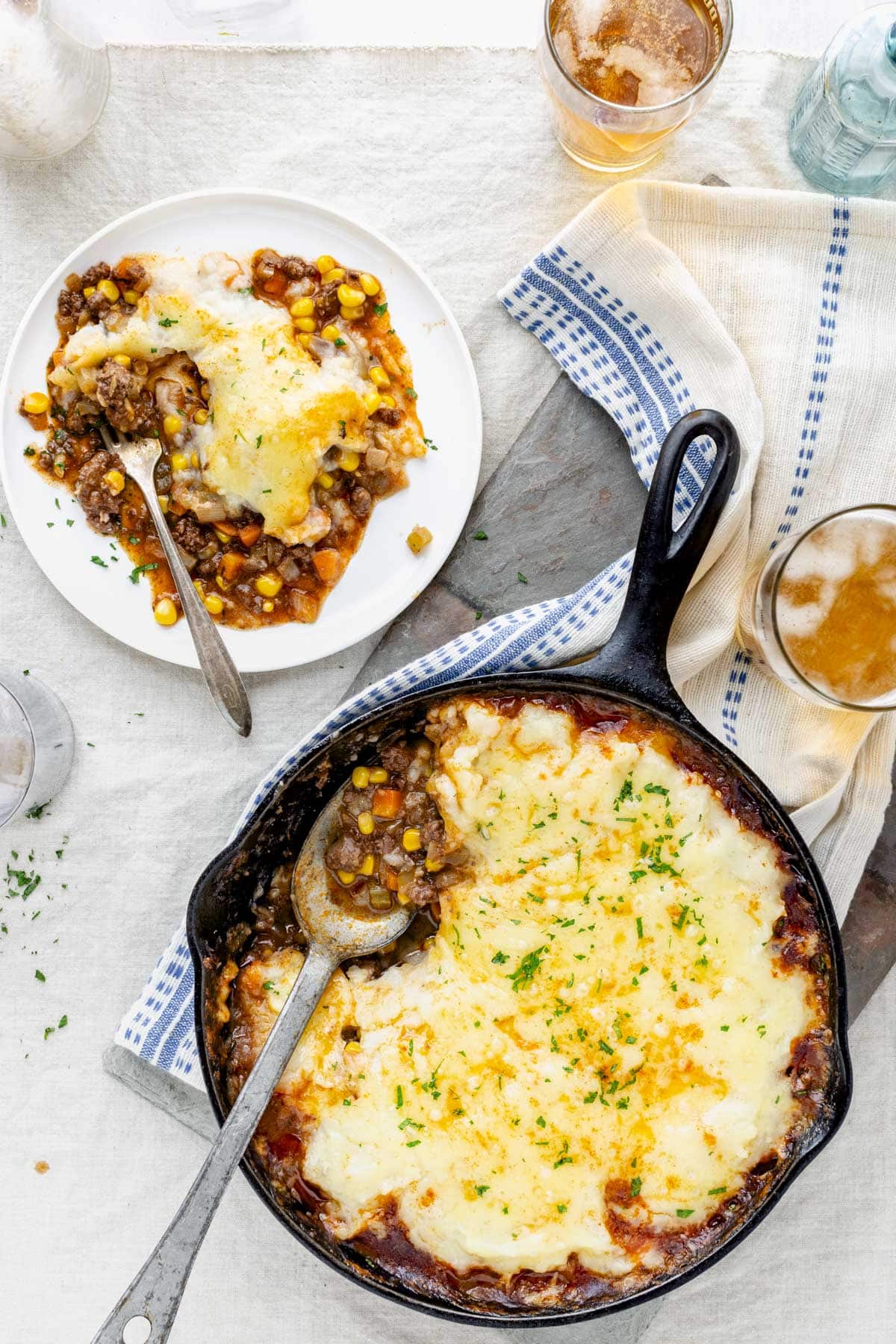 the shepherd's pie in the skillet and on a plate