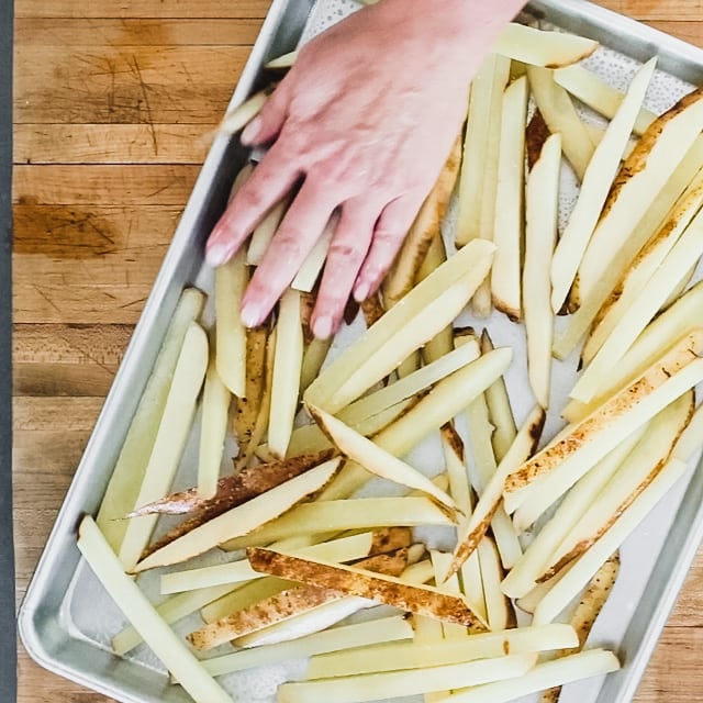 Spread the potatoes out on the sheet pan