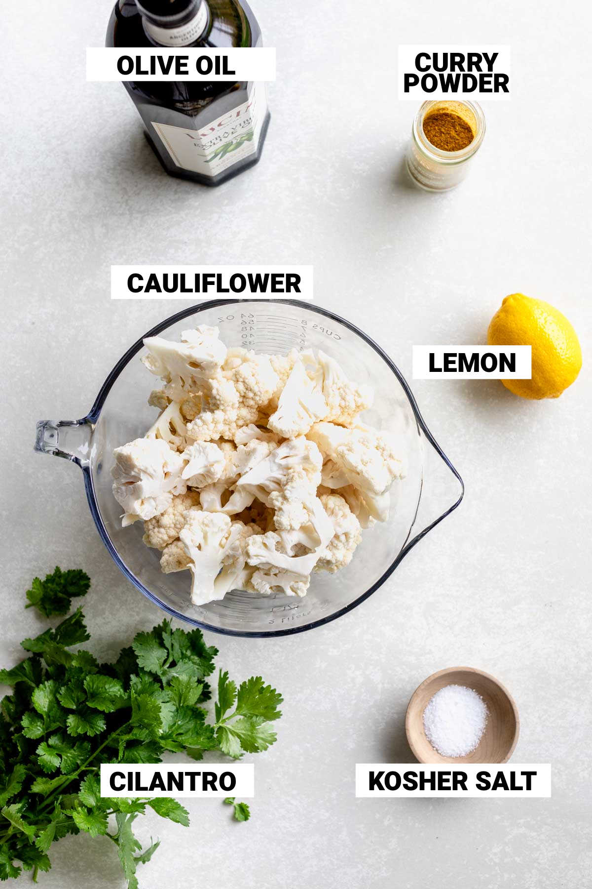the cauliflower and other ingredients on a white table with text overlay