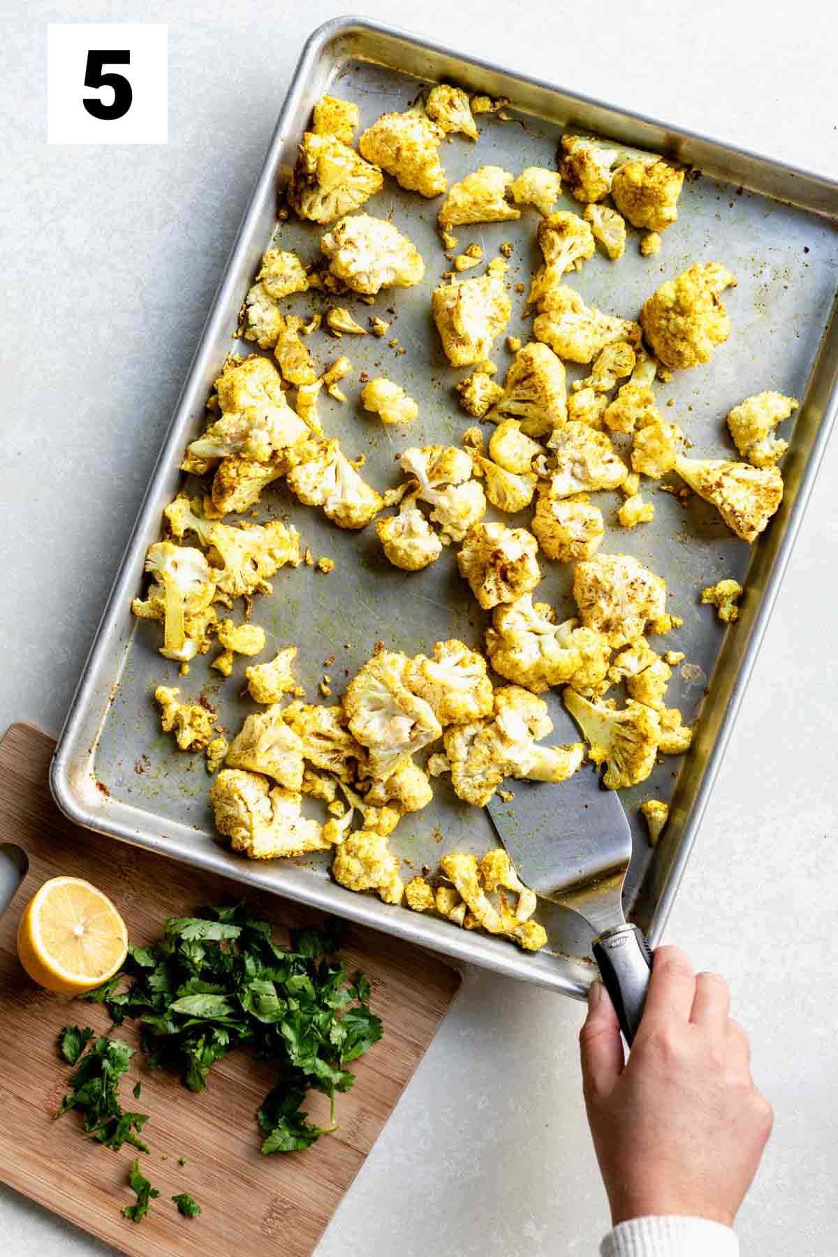 stirring the cauliflower with a spatula