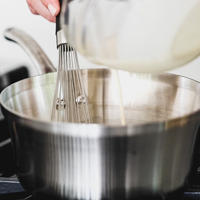 whisk slurry into the hot milk