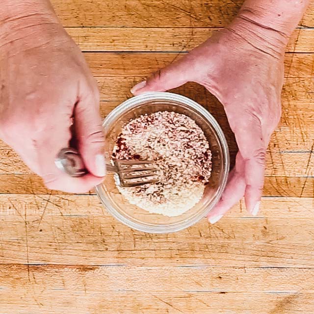 stirring breadcrumbs and spices