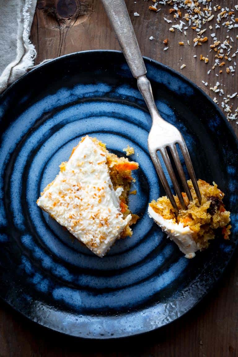 slice of healthy carrot cake on a plate with a fork
