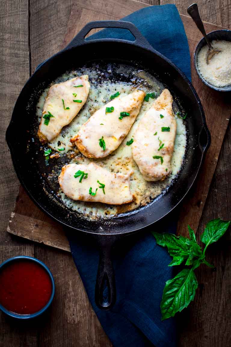 making healthy chicken parmesan in a skillet