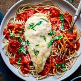 This Healthy 30 Minute Chicken Parmesan is ready in 30 minutes making it a perfect weeknight dinner. It’s a healthier version of the traditional recipe. Healthy Seasonal Recipes | Katie Webster