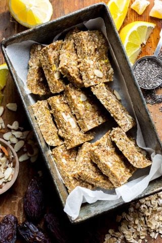Lemon, almonds, chia and crystallized ginger come together in these simple Lemon Ginger Chia No Bake Snack Bars. They are naturally sweetened with Medjool dates and honey and have a gluten free version. Healthy Seasonal Recipes | Katie Webster