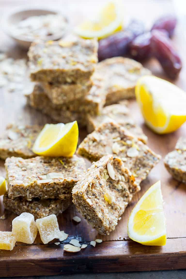 Lemon, almonds, chia and crystallized ginger bars on a board