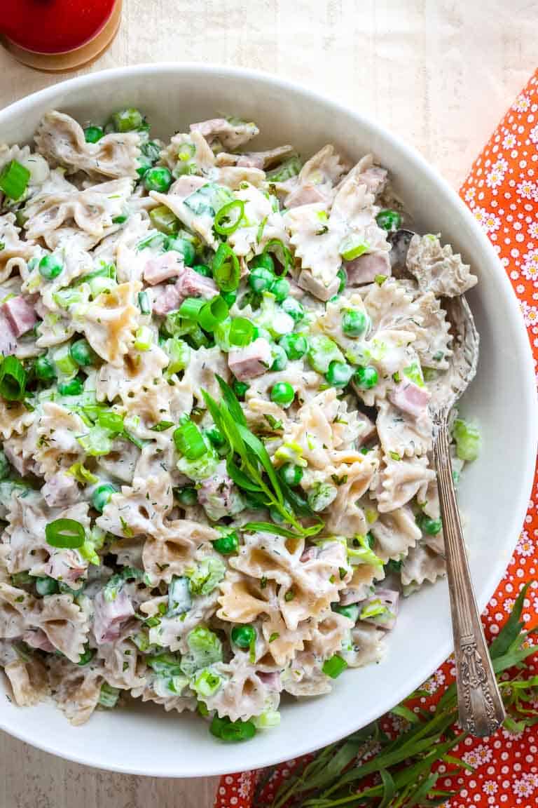 close up overhead of pasta salad with peas and ham