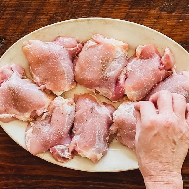 Sprinkle salt and pepper over the chicken.