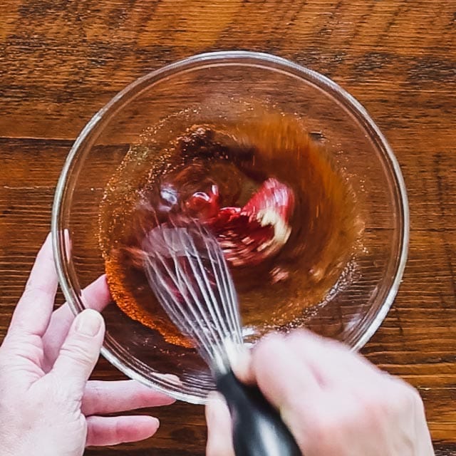 Whisk maple syrup, tomato paste, cider vinegar, chili powder, chipotle and garlic in a medium bowl.