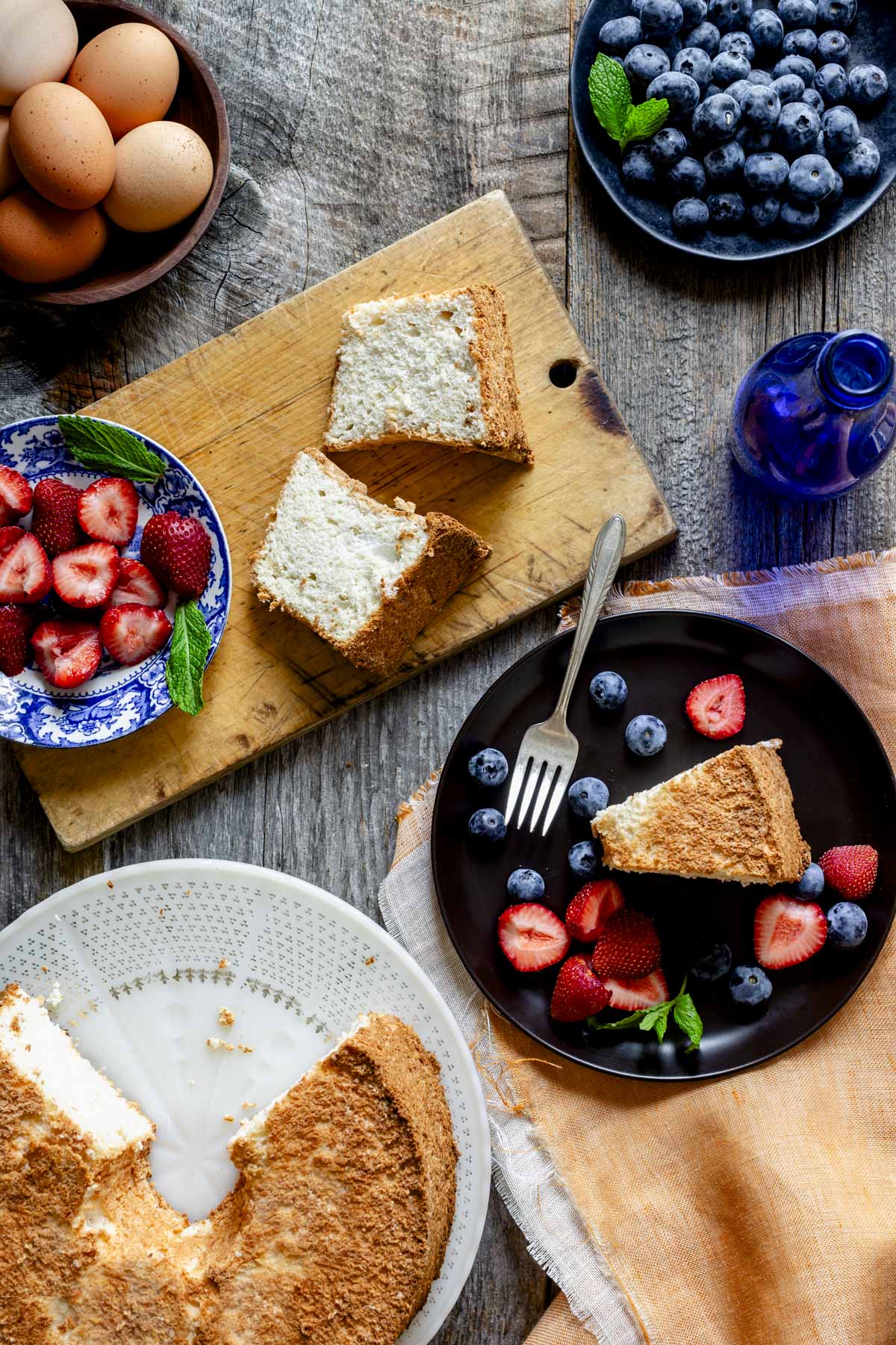 tablescape with the servings of angel food cake on a small cutting board
