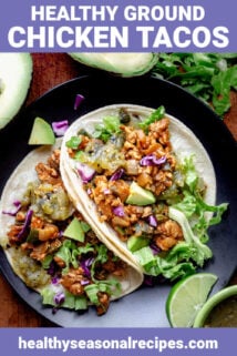 two tacos on a black plate with text overlay