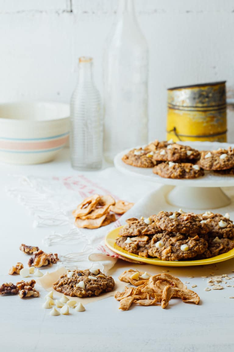 Chewy Oatmeal cookies, with white chocolate chips, walnuts and chunks of dried apple rings added in for a fall twist! | Healthy Seasonal Recipes | Katie Webster