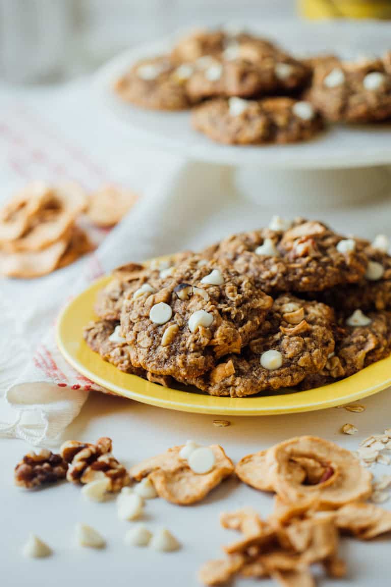 Chewy Oatmeal cookies, with white chocolate chips, walnuts and chunks of dried apple rings added in for a fall twist! | Healthy Seasonal Recipes | Katie Webster