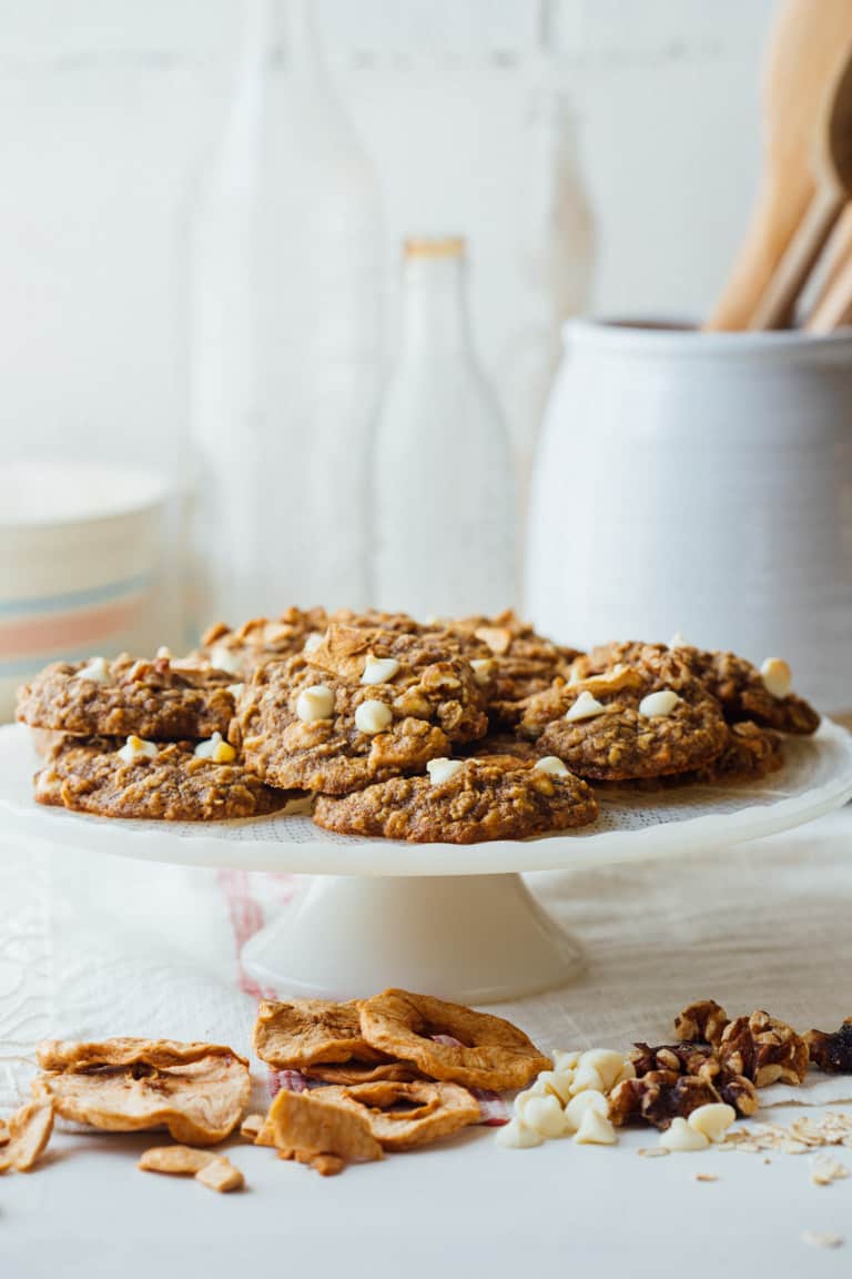 Chewy Oatmeal cookies, with white chocolate chips, walnuts and chunks of dried apple rings on a serving platter