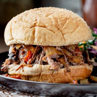 bbq shredded beef in a bun from the side