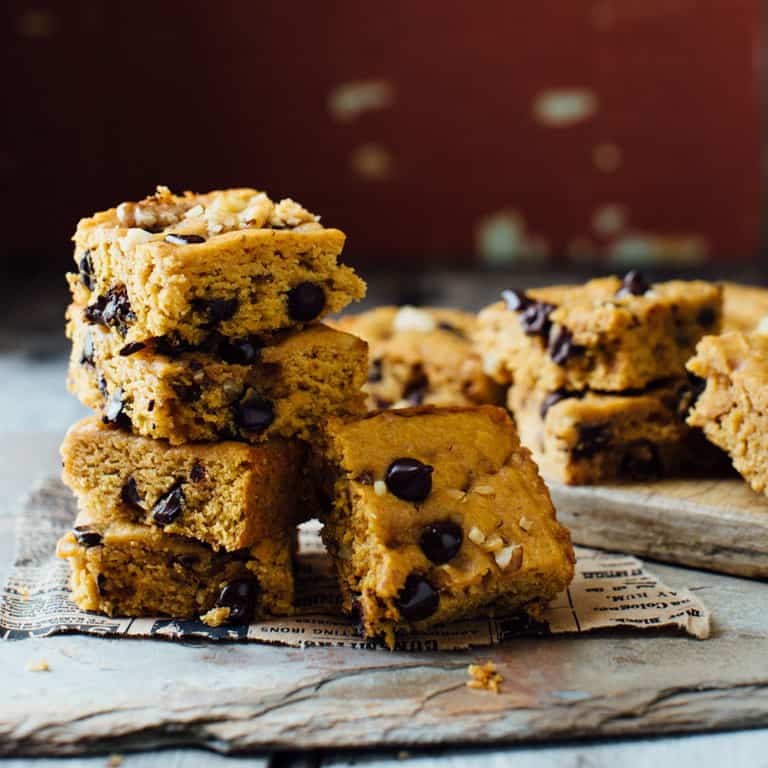 These Sweet Potato Blondies are chocked full of chocolate, toasted walnuts and are veggie packed, whole wheat and 100 calories less than the traditional version.Perfect for all of your Fall activities! | Healthy Seasonal Recipes
