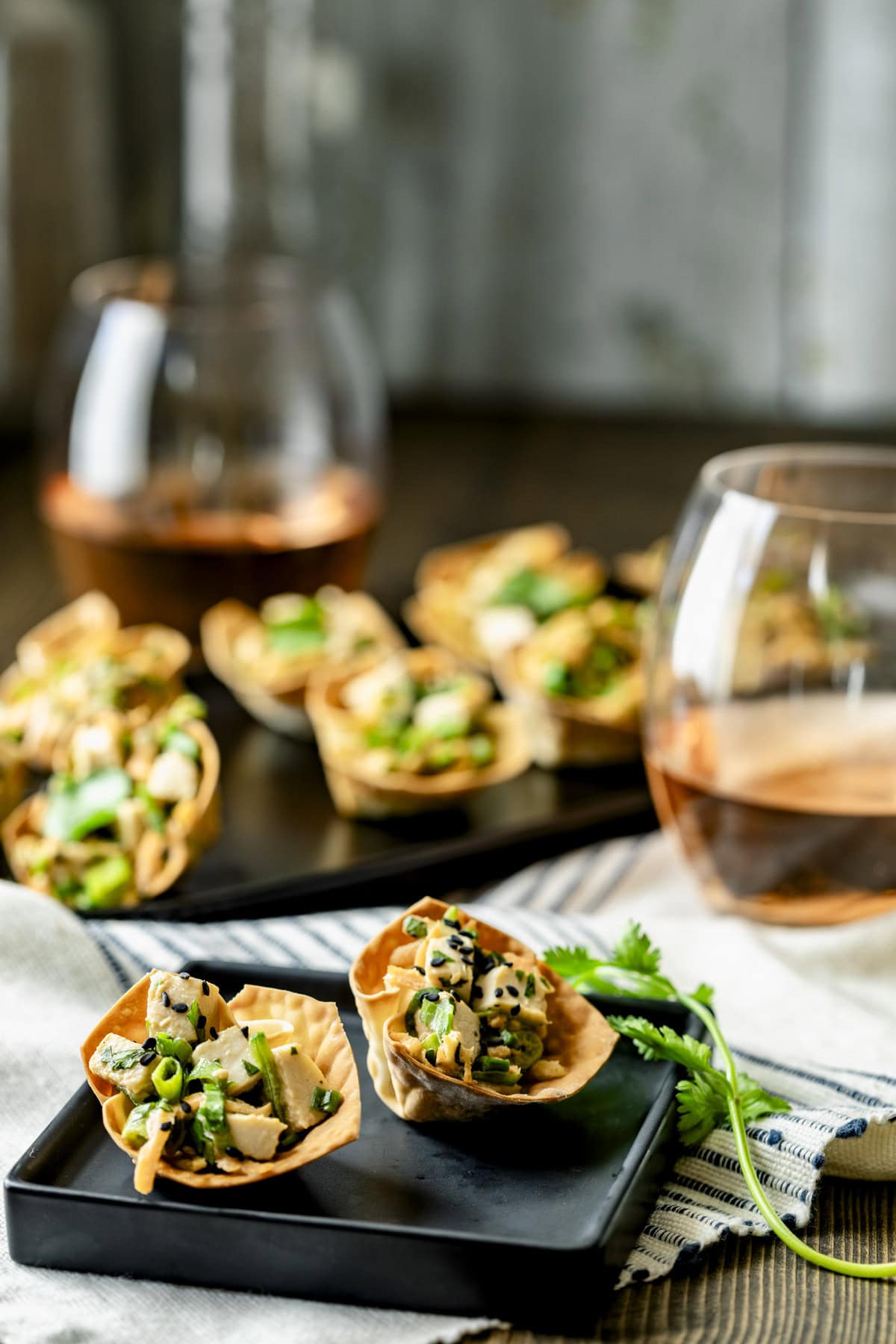 the appetizers on a small plate with the platter of them in the background