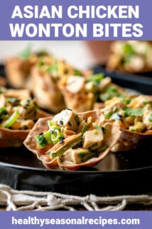 Sesame wonton cups on a black platter