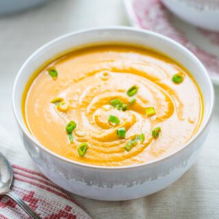 closeup of bowl of soup with a swirl on top