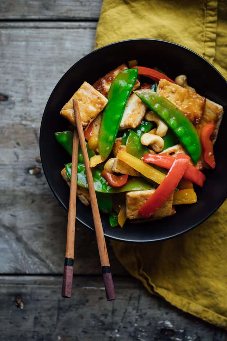 veggie stir fry in a bowl with chopsticks