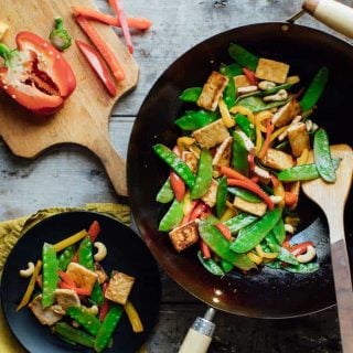 This Tofu Vegetable Stir-fry with Cashews meets all my requirements for an awesome weeknight dinner. It’s quick, easy, veggie-packed and super kid-friendly. | Healthy Seasonal Recipes | Katie Webster