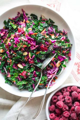 Festive Kale Slaw with Raspberries and Almonds, a festive gluten-free, vegan-friendly salad for Christmas or the holidays