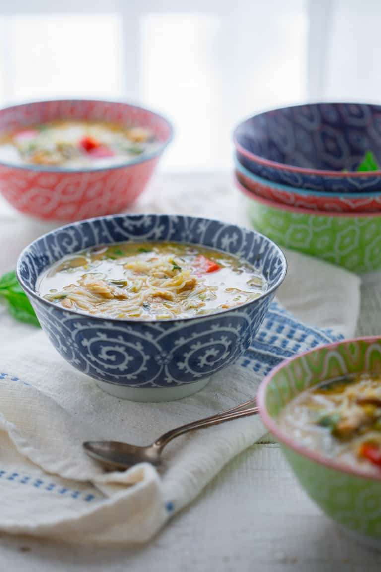 Slow Cooker Thai Chicken Coconut Soup with Rice Noodles in a serving bowl