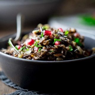 A close up of wild Rice with pomegranates
