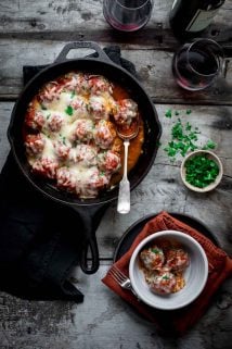 Healthier Baked Meatball Parmesan made with grass-fed beef and bulgar wheat. Baking the meatballs on a rack helps prevent them from becoming greasy. HealthySeasonalRecipes.com #grassfedbeef #meatballparm #italianfood #comfortfood #healthyrecipe