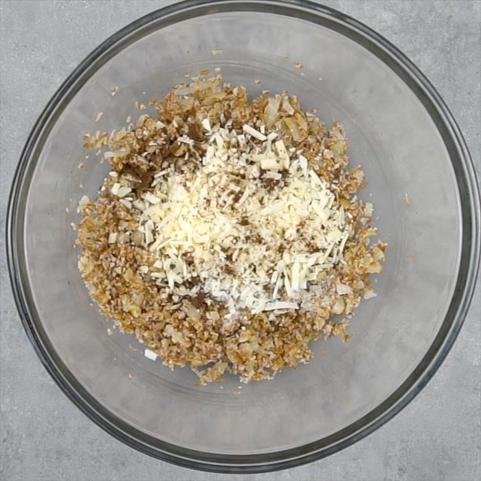 Combine drained bulgur and onion mixture in a bowl and let cool 10 minutes. Then stir in egg white, parmesan and seasonings.