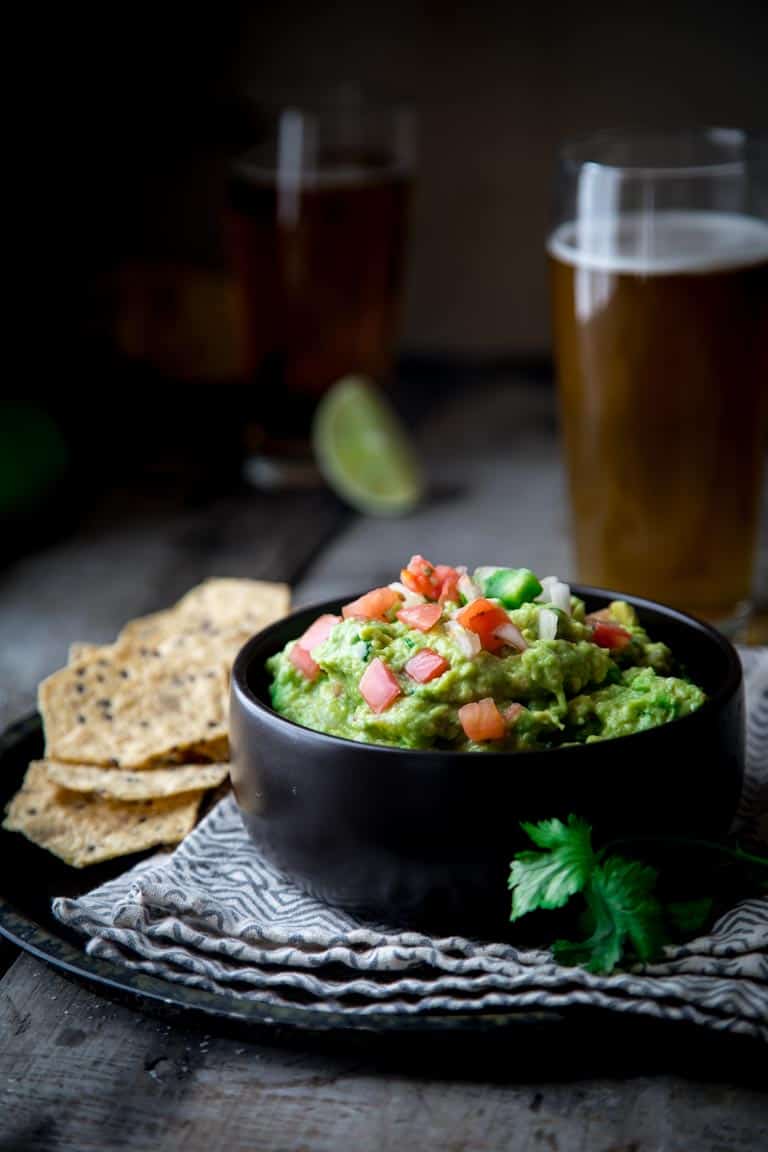 Chunky Pico De Gallo Guacamole on Healthy Seasonal Recipes. Learn how to make guacamole 5 ways for a festive and delicious twist on authentic guacamole for your next party! @healthyseasonal #glutenfree #vegan #guacamole #superbowl #cincodemayo #healthyrecipe