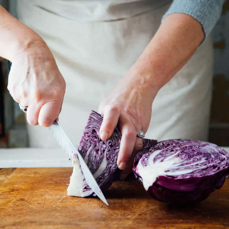 Remove the core from a head of cabbage