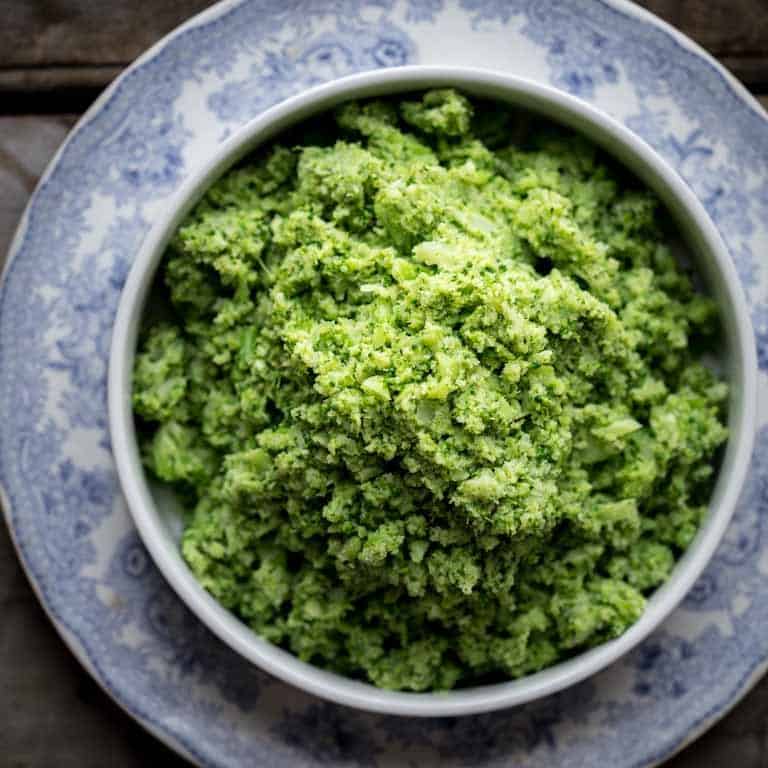 mashed broccoli on a blue dish