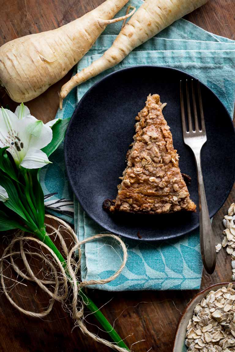 slice of maple coffee cake next to parsnips