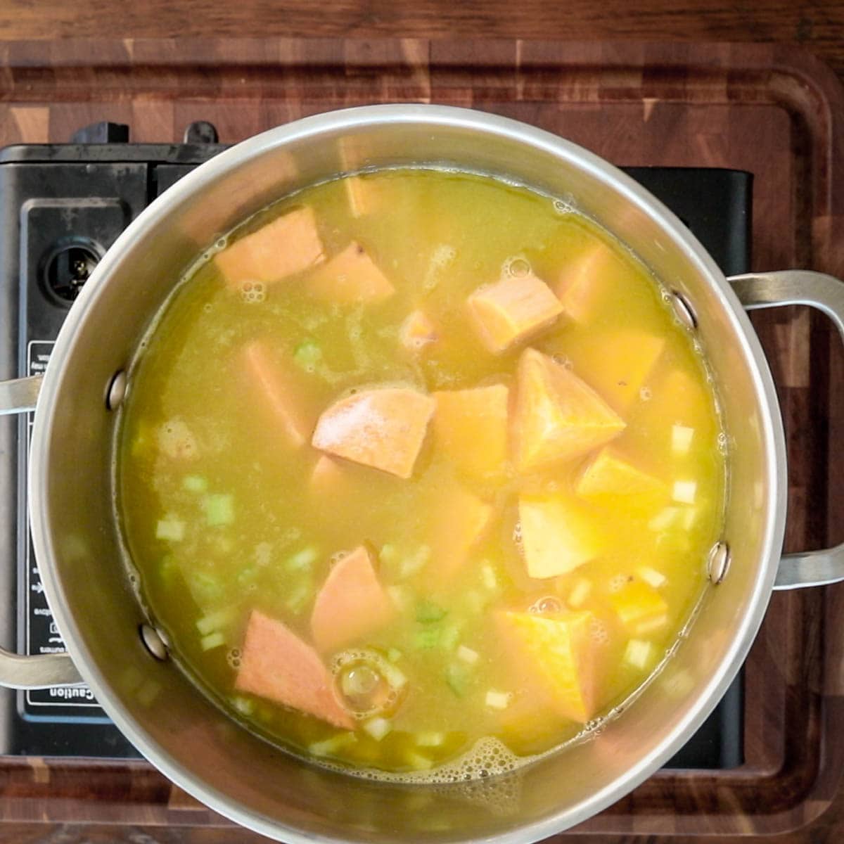 add the sweet potato and celery and broth